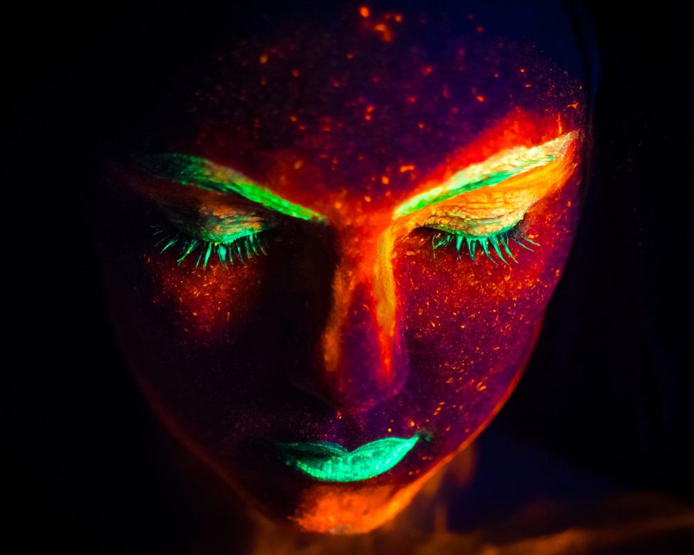 portrait-of-woman-with-fluorescent-paint-makeup-un-2022-11-15-02-35-51-utc